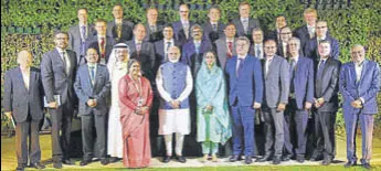  ?? PTI ?? Prime Minister Narendra Modi and Minister for Food Processing Industries Harsimrat Kaur Badal with business leaders at the World Food India event in New Delhi on Friday