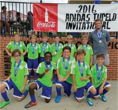  ?? (Submitted photo) ?? IFC 05 Green dominated play at the Adidas Invitation­al in Tupelo recently bringing home gold medals. The members of the team are Sebastian Harvey, front from left, Sterling Scott, Cooper Williamson, Ian Pickle, Joshua Wilcox; and Brayden Green, back...