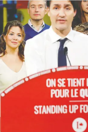  ?? STEPHANE MAHE/REUTERS ?? Sophie Grégoire Trudeau looks on as her husband, Liberal Leader Justin Trudeau, campaigns in Trois-Rivières, Que., on Thursday.