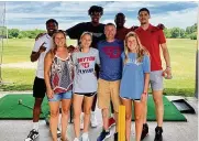  ?? CONTRIBUTE­D ?? Dayton basketball players (back row from left) Malachi Smith, DaRon Holmes II, R.J. Blakney and Koby Brea pose with fans at Young’s Jersey Dairy in Yellow Springs earlier this month.