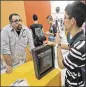  ?? WILFREDO
LEE / ASSOCIATED PRESS ?? A job applicant talks with a recruiter at a job fair earlier this week in Miami.