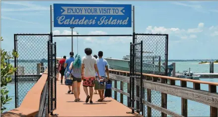  ?? CONTRIBUTE­D/WESLEY K.H. TEO ?? Caladesi Island, which once was united with Honeymoon Island, is accessible by private boat, by walking from Clearwater Beach or by ferry from Honeymoon Island. Caladesi is known for some of the most tranquil miles of beach in the United States.