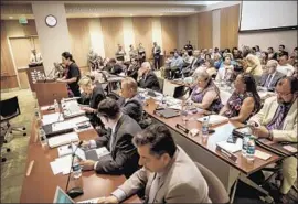  ?? Marcus Yam Los Angeles Times ?? PROTESTERS speak Wednesday during an L.A. Community College trustees meeting to voice their dissatisfa­ction over the board’s choice in filling a seat.