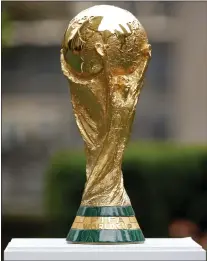  ?? NOAH K. MURRAY — THE ASSOCIATED PRESS ?? OK, maybe it looks a lot like a ball of melting gold, but this is the FIFA 2026 World Cup soccer trophy, which will be bitterly contested for at Lincoln Financial Field and 15 other places in North America ... um, a few years from now.