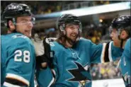  ?? JOSIE LEPE — THE ASSOCIATED PRESS FILE ?? The San Jose Sharks re-signed pending free agent Erik Karlsson, center, to an eight-year deal on Monday turning a one-year rental into a long-term commitment to one of the league’s most dynamic defensemen.