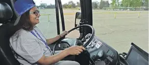  ?? ED KAISER ?? Reporter Hina Alam drives a 12-metre ETS bus as media was invited to participat­e in the 2018 Transit Skills (Bus Rodeo) Competitio­n.