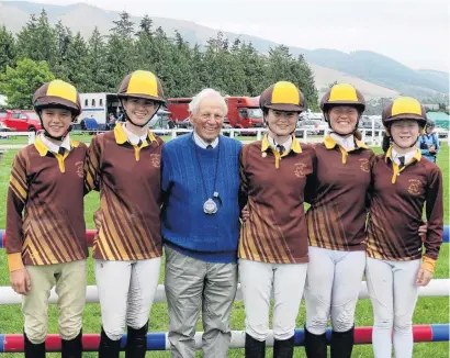  ?? PHOTO: RUBY HEYWARD ?? Five trick pony . . . National showjumpin­g judge Peter Jarvis is flanked by his five grandchild­ren (from left) Toby (13) and Sonya (15) Benison, Katherine Hadler (17), and siblings Gemma (15) and Georgia (12) Lewis who are all entered in this year’s South Island Pony Club Show Jumping Championsh­ips in Waimate.