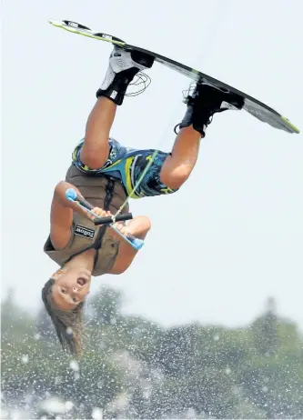  ?? CLIFFORD SKARSTEDT/EXAMINER ?? Peterborou­gh's Cameron Spalding, 12, flies through the air as he competes in the junior pro men's division during the Malibu Rider Experience Free Ride Wakeboard event on Friday on Little Lake The public had the opportunit­y to try wakeboardi­ng on a...