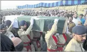  ?? ARSHAD BUTT — THE ASSOCIATED PRESS ?? Pakistani troops carry the casket, wrapped in national flag, of provincial candidate Siraj Raisani, who was killed in the Friday’s suicide bombing in Mastung.