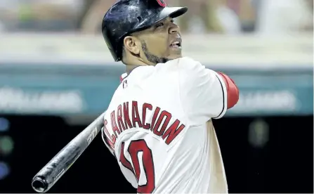  ?? TONY DEJAK/THE ASSOCIATED PRESS ?? Cleveland Indians’ Edwin Encarnacio­n hits an RBI-single off Toronto Blue Jays relief pitcher Jeff Beliveau during the seventh inning of a baseball game on Friday in Cleveland.