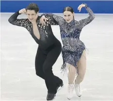  ?? THE ASSOCIATED PRESS ?? Tessa Virtue and Scott Moir perform their short dance on Thursday at the ISU Grand Prix Final in Nagoya, Japan. The world champs from Canada are second headed into Saturday’s free dance.