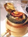  ?? REBECCA LO / FOR CHINA DAILY ?? Steamed fried rice with whole Australian abalone and wild fungus served at Sing Yin restaurant in Hong Kong.