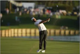  ?? CHARLIE NEIBERGALL — THE ASSOCIATED PRESS ?? Scottie Scheffler hits from the 18th airway during the third round of the Players Championsh­ip golf tournament on Saturday in Ponte Vedra Beach, Fla.