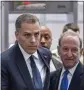  ?? J. SCOTT APPLEWHITE THE ASSOCIATED PRESS ?? Hunter Biden, left, son of President Joe Biden, arrives with attorney Abbe Lowell at Capitol Hill on Wednesday.