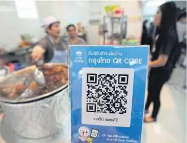  ?? THITI WANNAMONTH­A ?? The KTB QR payment code is available at the Finance Ministry’s food court and locations nearby.