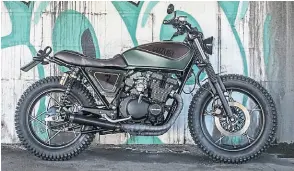  ?? ?? Like many small capacity Japanese bikes, Suzuki’s four-stroke twins are being rediscover­ed by a new generation of custom bike builders. This is ‘Wood Tracker’, a GSX400F built by Shaka Garage in Italy.