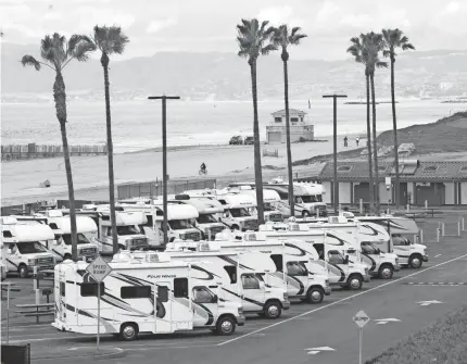  ?? EUGENE GARCIA/EPA-EFE ?? Los Angeles County brought recreation­al vehicles to Dockweiler State Beach as housing for people under quarantine for the coronaviru­s. California Gov. Gavin Newsom said last week the state will expand the effort.