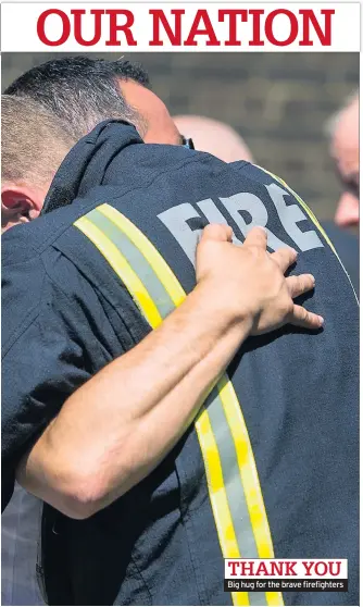  ??  ?? Big hug for the brave firefighte­rs THANK YOU