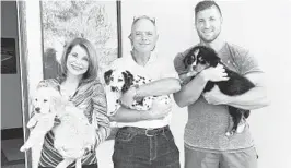  ?? DEMI-LEIGH NEL-PETERS VIA FACEBOOK ?? Tim Tebow, right, and his parents Pam and Bob are pictured with canines in hand in April 2020 for a Facebook post showing what Tim described as“the Tebow Pack excited to meet the Grandparen­ts.”