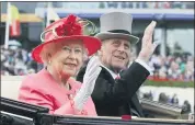  ?? ASSOCIATED PRESS FILE PHOTOS ?? Britain’s Queen Elizabeth II with Prince Philip arrive by horse drawn carriage in the parade ring at the of the Royal Ascot horse race meeting at Ascot, England.