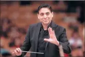  ?? PHOTOS PROVIDED TO CHINA DAILY ?? Vijay Upadhyaya (left) will take the baton and lead the China National Symphony Orchestra Chorus (right) to premiere his latest compositio­n, Chang’an Men, in Beijing in November.