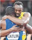  ??  ?? Usain Bolt embraces US athlete Justin Gatlin.