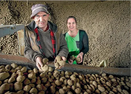  ??  ?? Heartland Potato Chips manager Charlotte Bowan with her father, owner Raymond Bowan.