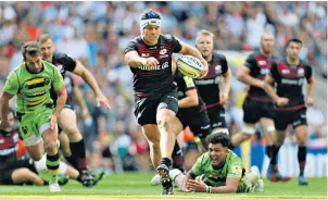  ??  ?? Out on his own: Schalk Brits races clear to score Saracens’ eighth try and Sean Maitland touches down for the first of his hat-trick, right