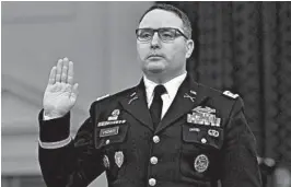  ?? ANDREW CABALLERO-REYNOLDS/GETTY-AFP 2019 ?? Lt. Col. Alexander Vindman is sworn in Nov. 19 at a House hearing in President Trump’s impeachmen­t case. Vindman’s attorney said the decorated Iraq War veteran is retiring.