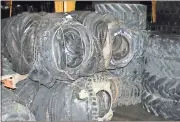  ?? Doug Walker / RN-T ?? Tires are baled and ready for recycling in a Green Carbon warehouse in North Rome. Green Carbon and Caterpilla­r have developed a system that is completely self-sustaining and does not need any outside power source to facilitate the process of returning...