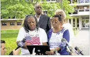  ??  ?? Jennifer Danner (left), sister of Deborah Danner, speaks to reporters with relatives and friends Wednesday near the Bronx building where Deborah Danner was fatally shot by a New York City police sergeant Tuesday.