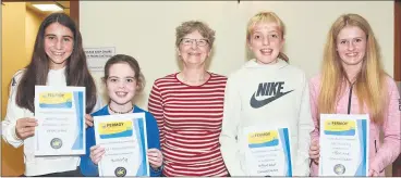  ?? ?? Award winners at our recent AGM and awards night: Ava Fleming (technical excellence in frontcrawl), Elsa Higginboth­am (technical excellence in butterfly), Ciara O’Toole (excellence in effort and commitment) and Abi Murphy (excellence in effort and commitment), pictured with coach Paula Finn.