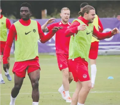  ?? DEREK VAN DIEST / POSTMEDIA NEWS FILES ?? Canada's Alphonso Davies, left, and Samuel Piette warm up at a training session in Florida in 2019. Both players are expected to be key contributo­rs to the 2021 national men's soccer team. Davies is still overseas with Bayern Munich.