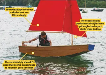  ??  ?? The red sails give the boat a similar look to a Mirror dinghy The varnished ply shouldn’t need much some maintenenc­e to keep it in good condition The headsail helps performanc­e but jib sheets get tangled on halyard cleats when tacking