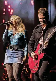  ?? [PHOTOS BY NATHAN POPPE, THE OKLAHOMAN] ?? Miranda Lambert and guitarist Alex Weeden perform live March 9 at the Chesapeake Energy Arena.