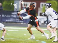  ?? Erik Trautmann / Hearst Connecticu­t Media ?? Ridgefield’s Weston Carpenter, left, takes a shot on goal against Wilton in their FCIAC boys lacrosse game on Thursday in Wilton.