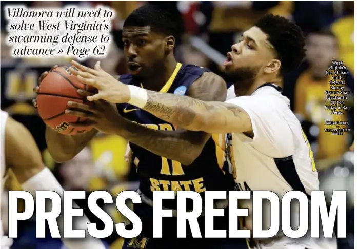  ?? GREGORY BULL — THE ASSOCIATED PRESS ?? West Virginia’s Esa Ahmad, right, defends Murray State’s Shaq Buchanan (11) on Friday in San Diego.
