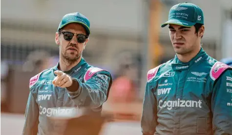  ?? Foto: dpa ?? Sebastian Vettel (links) und Lance Stroll werden auch in der neuen Saison Teamkolleg­en bei Aston Martin sein. Das Team bestätigte die beiden am Donnerstag. Damit sind bei Vettel die Spekulatio­nen um ein Karriereen­de – zumindest vorerst – beendet.