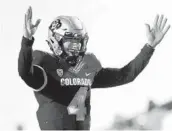  ?? MATTHEW STOCKMAN GETTY IMAGES ?? Quarterbac­k Sam Noyer of Colorado celebrates a touchdown against UCLA on Saturday.