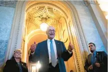  ?? DREW ANGERER/GETTY ?? Senate Majority Leader Chuck Schumer, D-N.Y., celebrates passage of the economic package Sunday.