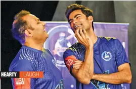  ??  ?? Former Indian cricketer Virender Sehwag ( left) and Mohammad Kaif share a lighter moment at a promotiona­l event in Mumbai on Monday.