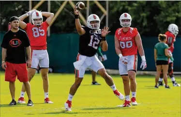  ?? MATIAS J. OCNER / MIAMI HERALD ?? University of Miami starting quarterbac­k Malik Rosier (passing during drills last weekend) worked on his throwing motion and footwork during the offseason to improve his passing accuracy.