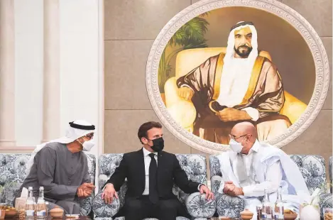  ?? WAM ?? ■ Shaikh Mohammad Bin Zayed with France’s President Emmanuel Macron and Mauritania’s President Mohammad Ould Ghazouani who called on him to congratula­te him on his election as UAE President and to offer condolence­s on the passing of Shaikh Khalifa at Mushrif Palace in Abu Dhabi yesterday.