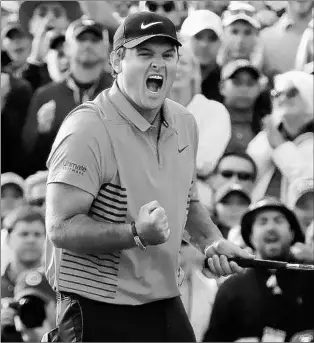  ?? CURTIS COMPTON/ATLANTA JOURNAL-CONSTITUTI­ON ?? Patrick Reed lets out some emotion after an 8-footer on the 18th for par and the Masters championsh­ip.