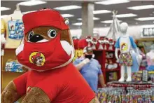  ??  ?? A masked Buc-ee’s character at the famed rest stop chain in Katy is a reminder to wear a mask.