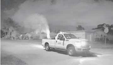  ?? MICHAEL LAUGHLIN/STAFF PHOTOGRAPH­ER ?? Broward County began its first truck spraying of the year April 30 to kill infant mosquitoes that are expected to multiply as the region’s heavy rains increase.