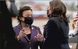  ?? Jacquelyn Martin Associated Press ?? R E P. Barbara Lee (D-Oakland), left, with Vice President Kamala Harris, cast the only vote against the military force resolution when it was adopted 19 years ago.