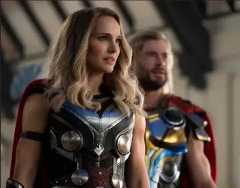  ?? / Marvel Studios ?? Natalie Portman, left, plays Mighty Thor and Chris Hemsworth plays Thor in Marvel Studios' "Thor: Love and Thunder."