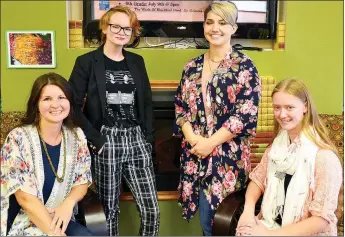  ?? TIMES photograph by Annette Beard ?? The staff of the Pea Ridge Community Library greets patrons with smiles. They are, from left, Debi Hale, clerk and grant seeker; Becca Tillman, clerk; Alex Wright, director; and Mary Maness, clerk.