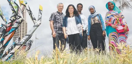  ?? Picture: SCOTT FLETCHER ?? People new to Australia will be among many participat­ing in a walk celebratin­g multicultu­ralism. Savio Lawrence, Zuki Chan, Akram Naffeh, Darartu Basha and Medina Keerar are all set for the Walk Together march.
